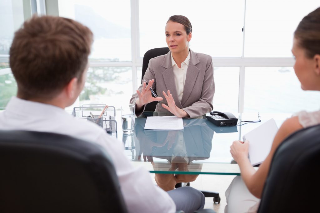 Couple consulting with lawyer