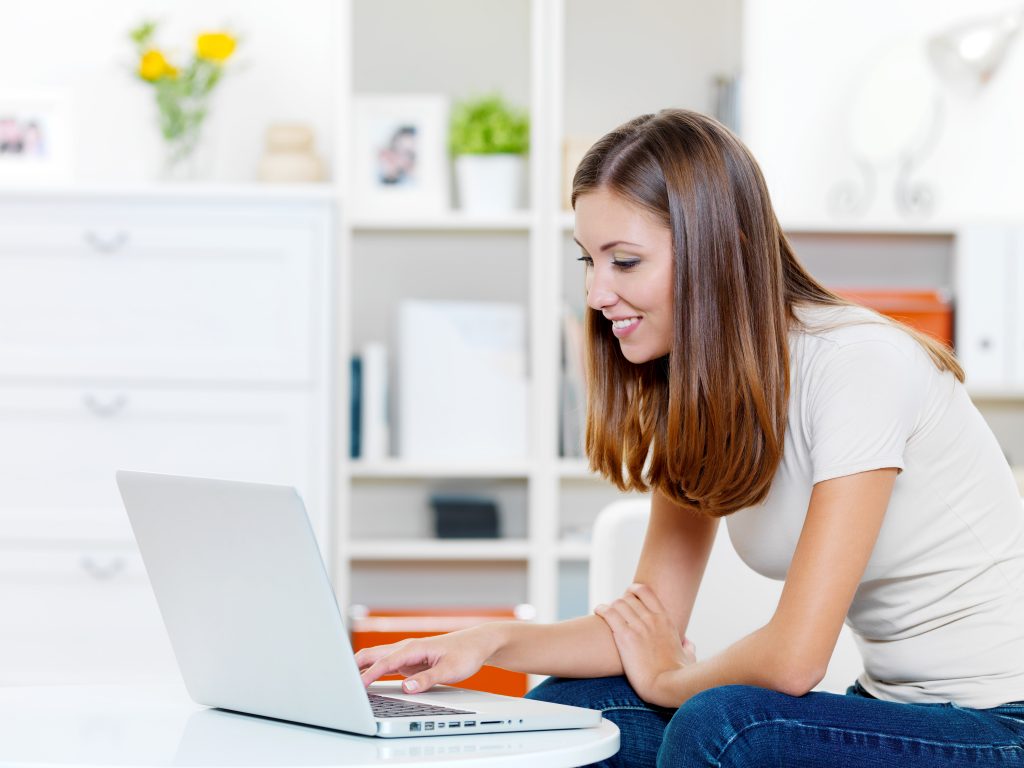 Woman enrolling online for a prepaid legal plan.