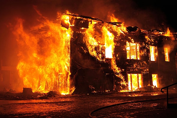 Home on fire at night