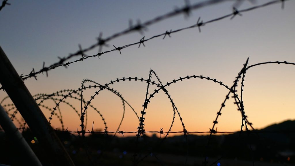 Barbed wire with sunset